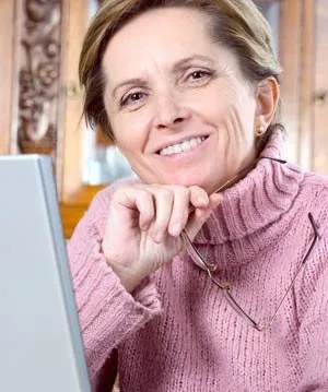 Smiling older woman with immediate dentures