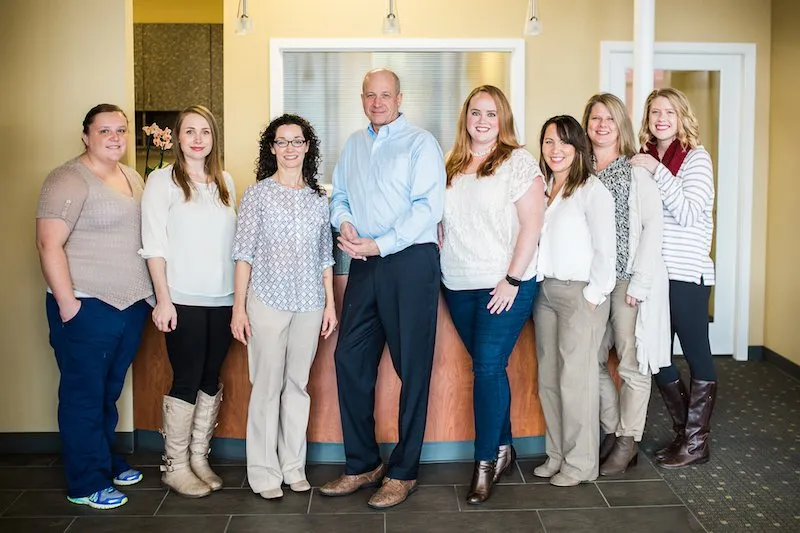 Group photo of the team at Olympic Dental and Denture Center